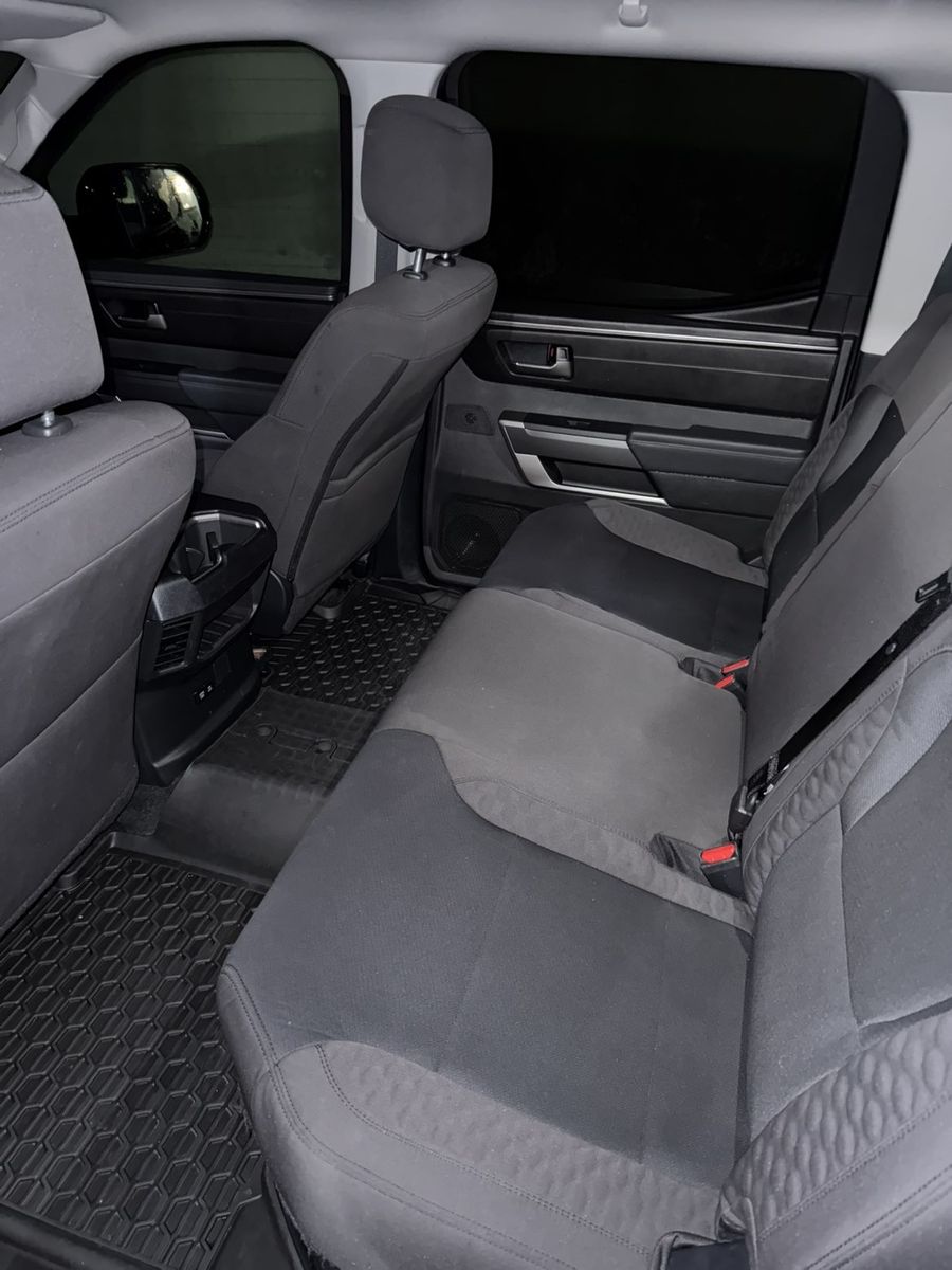 After: the same rear bench seat and floor mats, cleaned