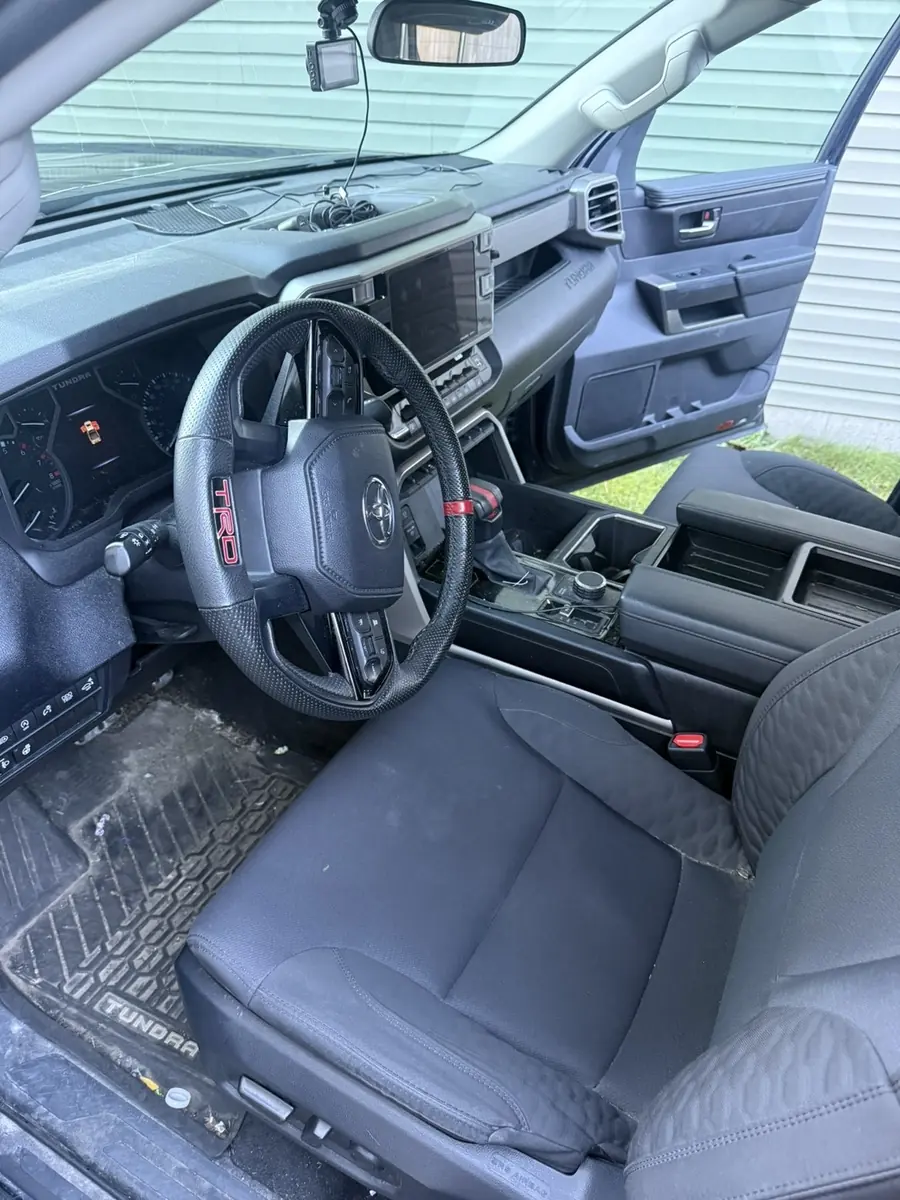 Before: driver's seat of a pickup truck