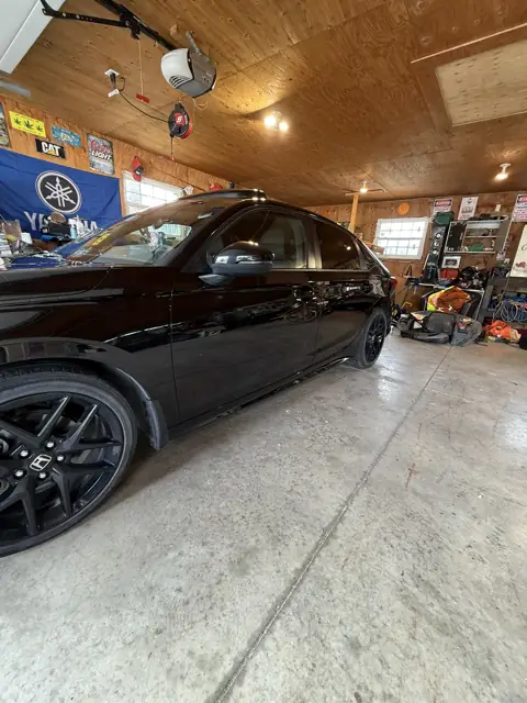 Black sedan, foam wash and gloss finish